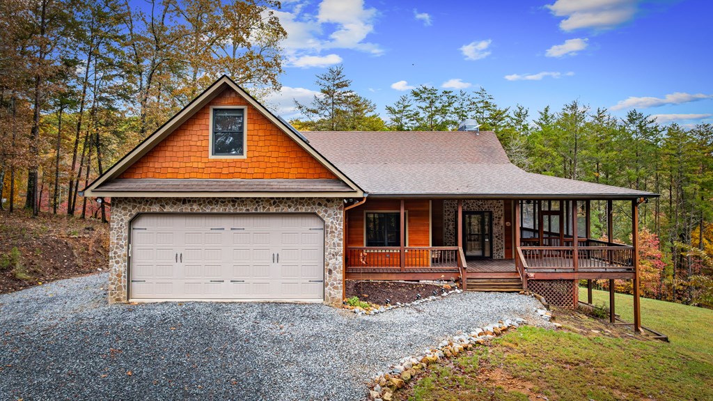 34 Smokey Ridge Lane Morganton, GA 30560 - Photo 2 of 47 a backyard of a house with barbeque oven table and chairs