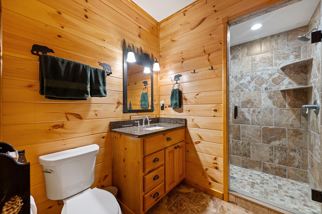 34 Smokey Ridge Lane Morganton, GA 30560 - Photo 23 of 47 a bathroom with a granite countertop toilet sink and mirror