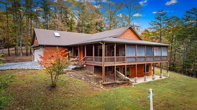 a view of a house with backyard porch and sitting area