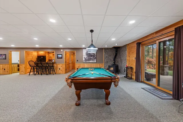a living room with furniture a table and chairs