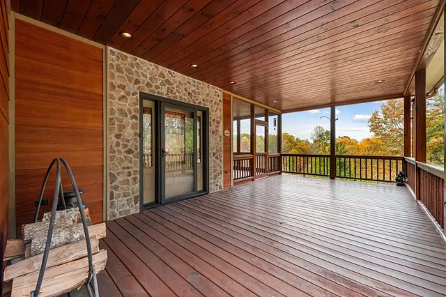 a view of a patio with wooden floor