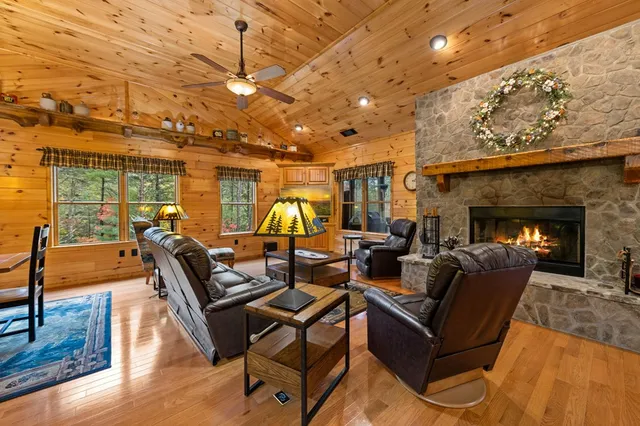 a living room with fireplace furniture and a fireplace