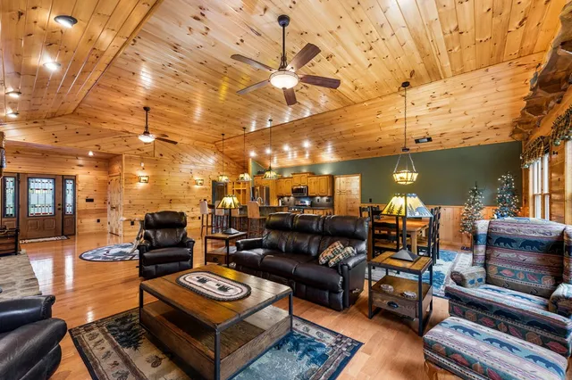 a outdoor living space with furniture and a fireplace