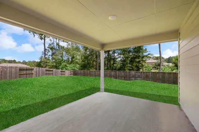a view of a porch and a yard