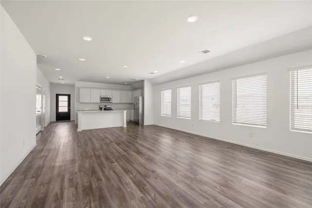 a view of a kitchen with a sink and dishwasher cabinets