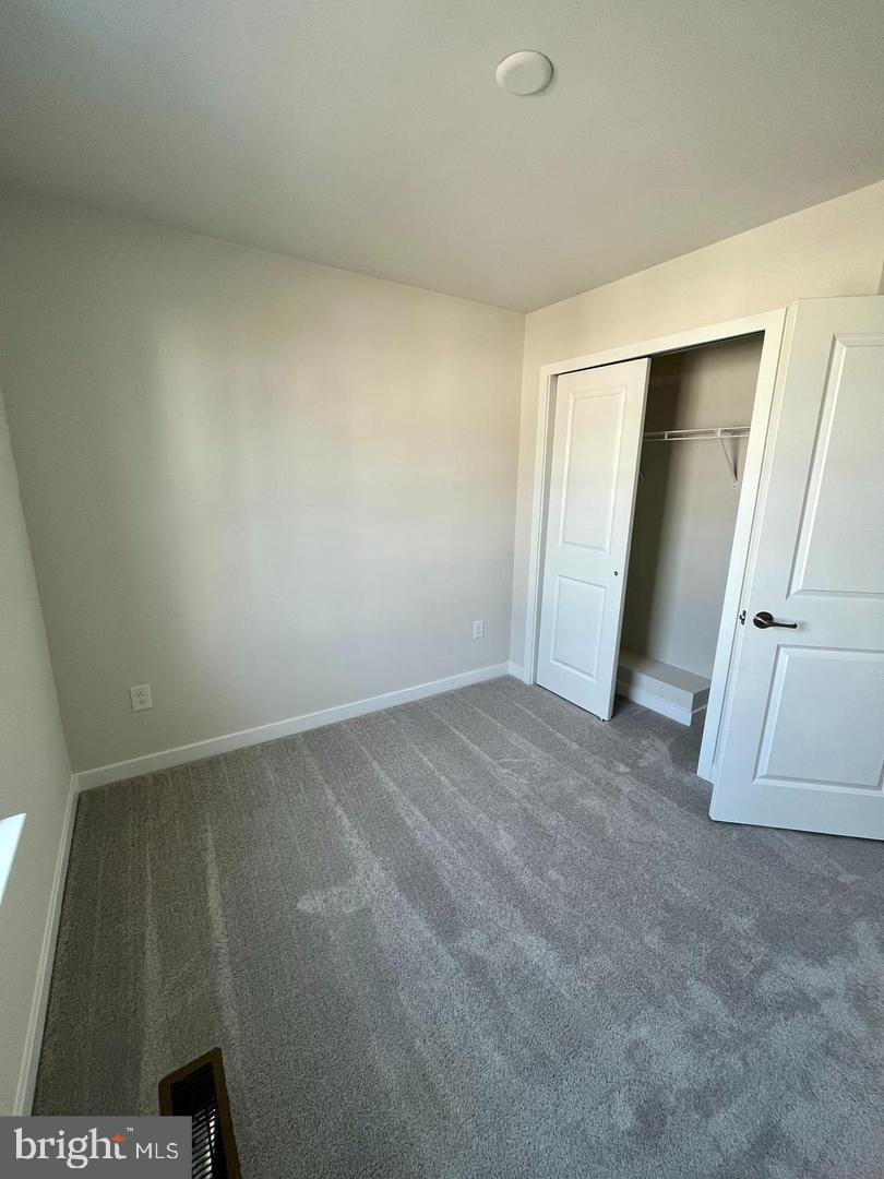 905 Magnolia Lane Spring City, PA 19475 - Photo 17 of 22 an empty room with a door