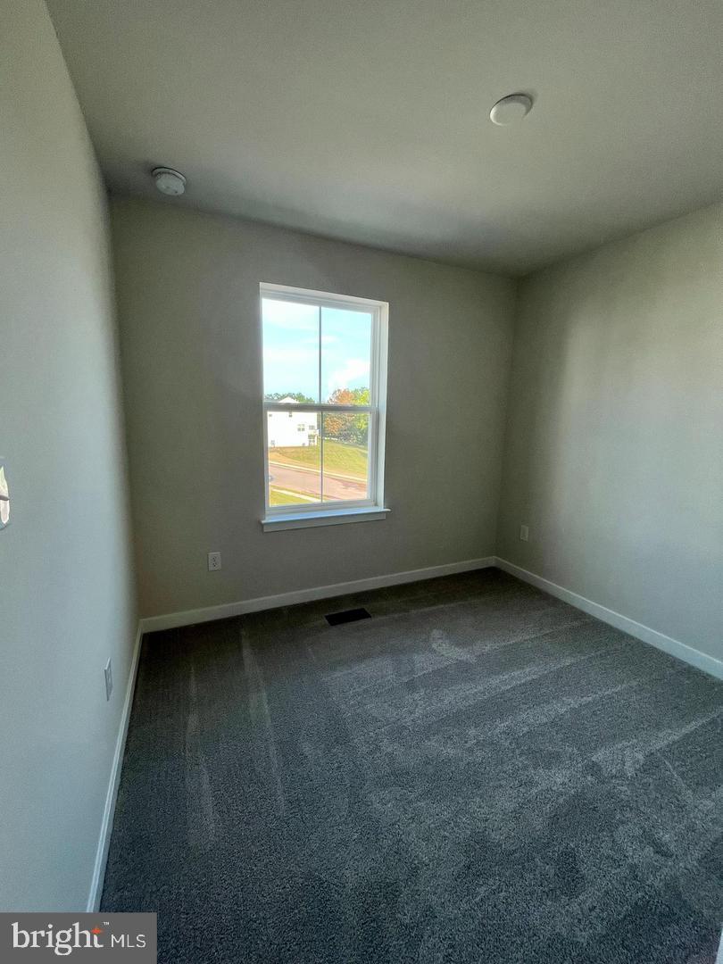 905 Magnolia Lane Spring City, PA 19475 - Photo 19 of 22 a view of an empty room with a window