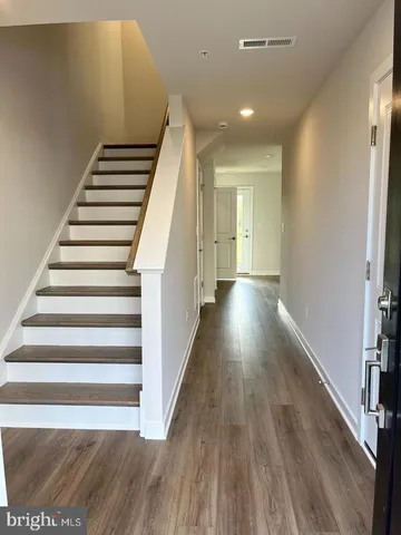 a view of entryway with wooden floor