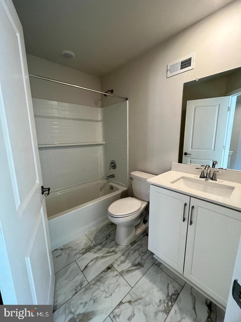 905 Magnolia Lane Spring City, PA 19475 - Photo 21 of 22 a bathroom with a sink a toilet a mirror and shower