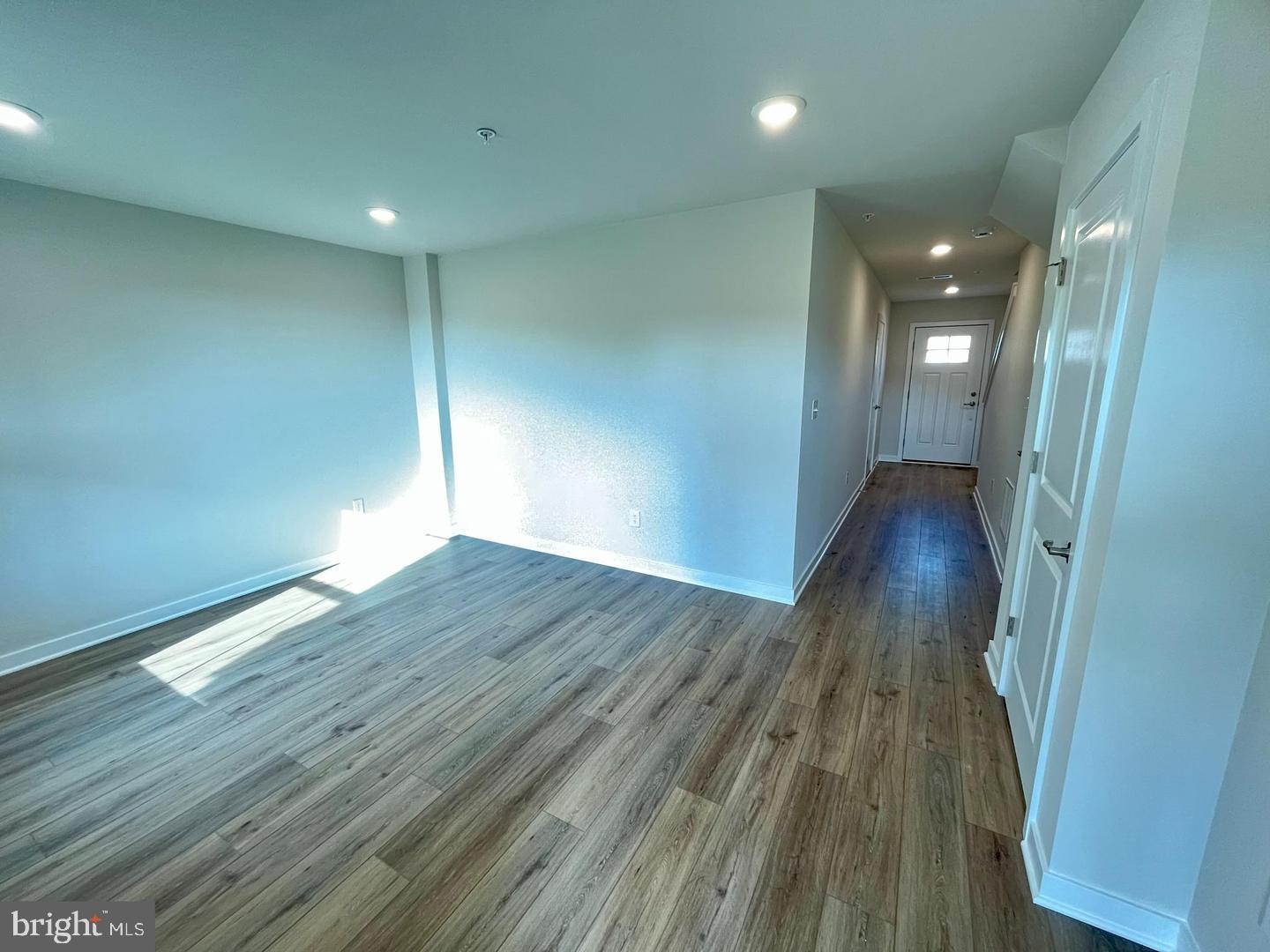 905 Magnolia Lane Spring City, PA 19475 - Photo 5 of 22 a view of wooden floor and windows in a room