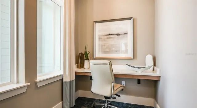 a dining room with furniture and window