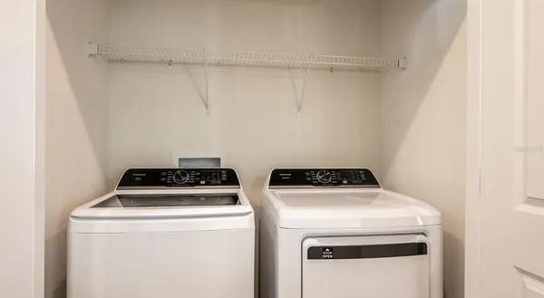 a utility room with dryer and washer