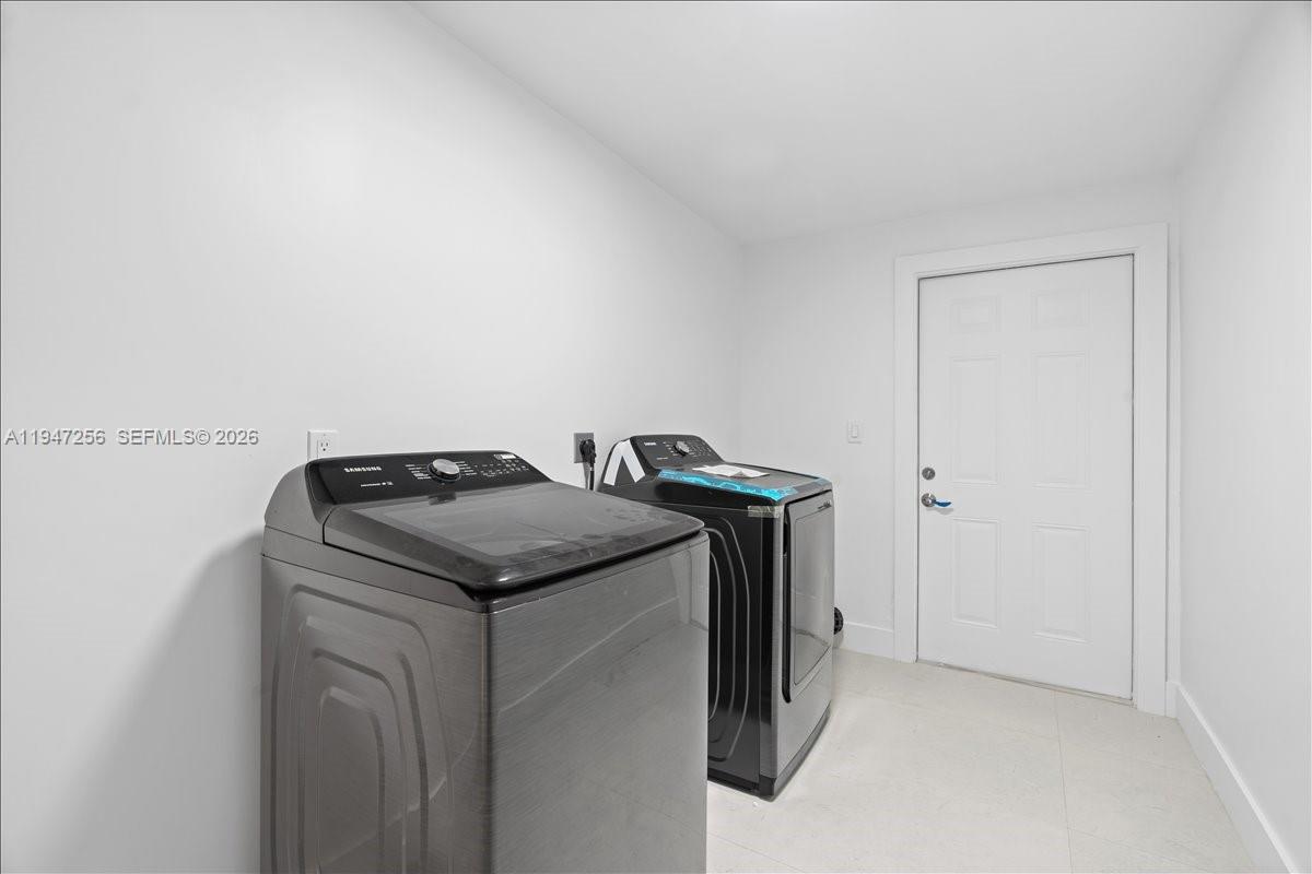 10351 Southwest 164th Street Miami, FL 33157 - Photo 17 of 19 a utility room with washer and dryer