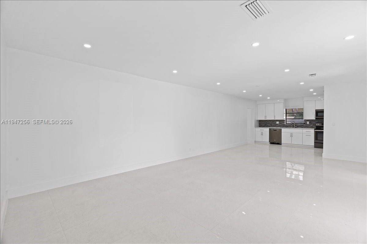 10351 Southwest 164th Street Miami, FL 33157 - Photo 5 of 19 a view of kitchen and kitchen with stainless steel appliances