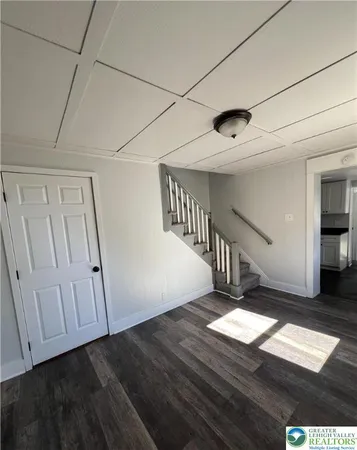 a view of entryway with wooden floor