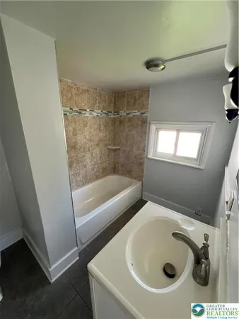 a bathroom with a sink and a tub