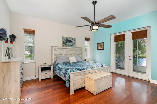 a bedroom with a bed and a table