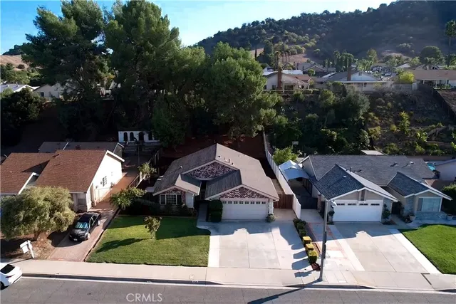 an aerial view of a house with a garden
