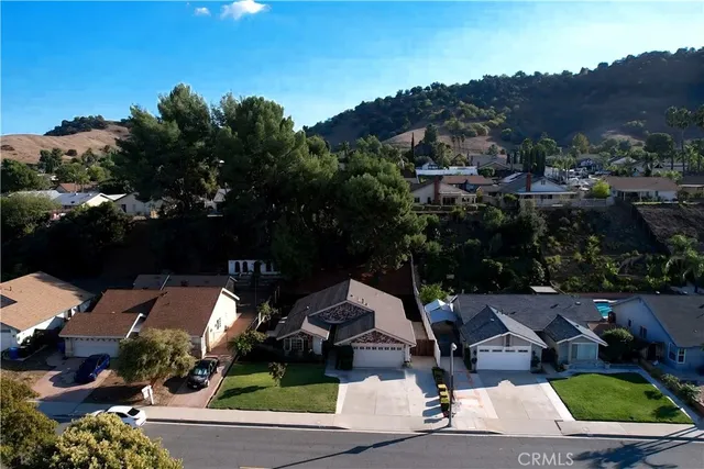 an aerial view of a house with a garden