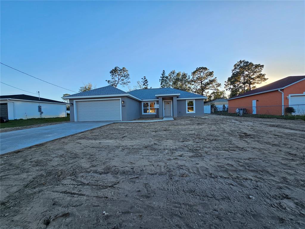 9541 Bahia Road Ocala, FL 34472 - Photo 1 of 1 a front view of a house with a yard