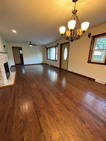 a view of a livingroom with wooden floor
