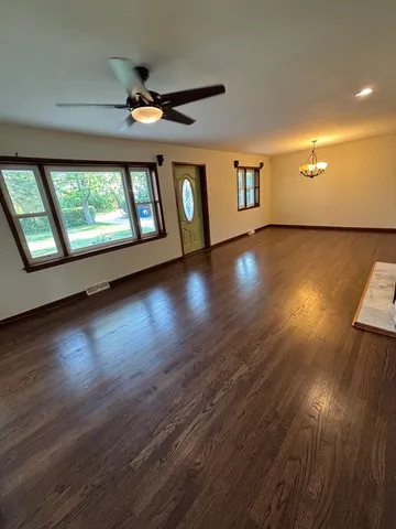 a view of hallway with wooden floor