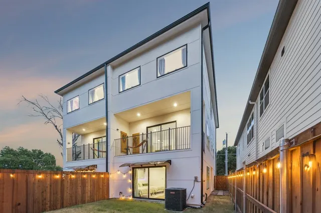 a view of a brick building with many windows