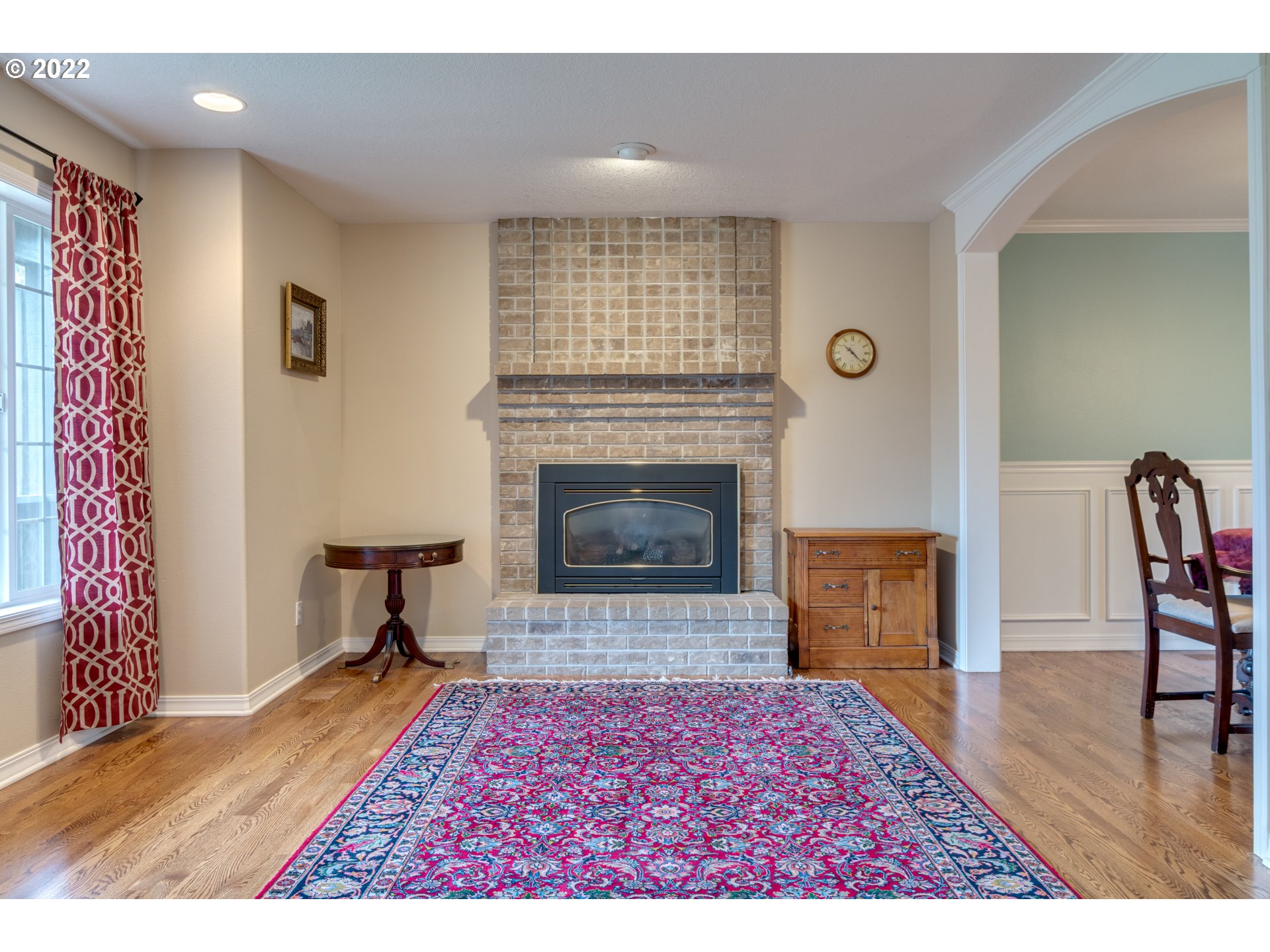 20195 Canyon Ridge Drive Oregon City, OR 97045 - Photo 16 of 24 a living room with furniture and a fireplace
