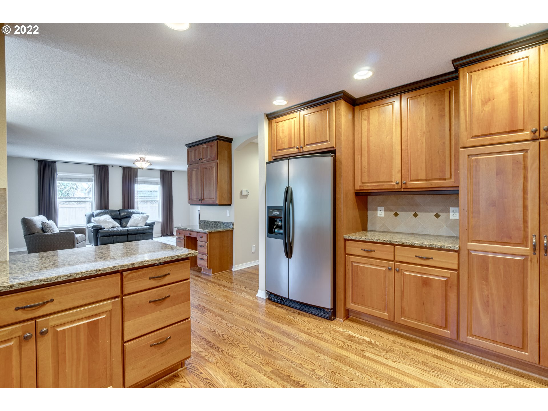 20195 Canyon Ridge Drive Oregon City, OR 97045 - Photo 9 of 24 a kitchen with stainless steel appliances granite countertop a refrigerator sink and cabinets