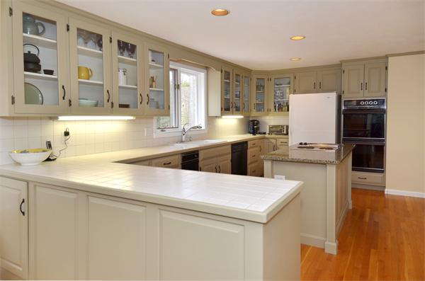 12 Tanglewood Road Boxford, MA 01921 - Photo 4 of 30 a kitchen with a sink a stove and refrigerator