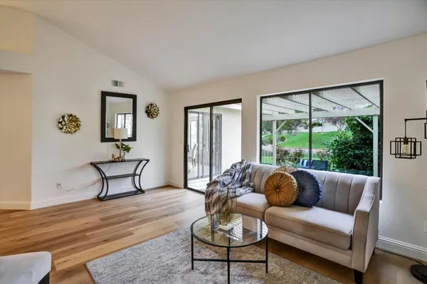 a living room with furniture and a large window
