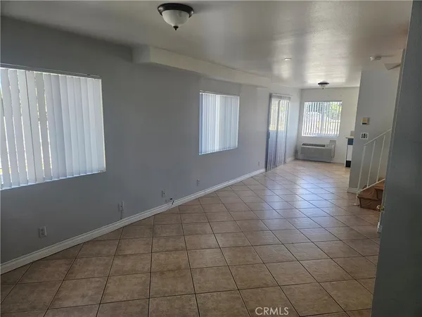 a kitchen with a stove sink and cabinets