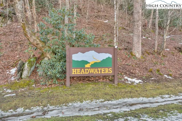 a sign that is sitting on a brick road