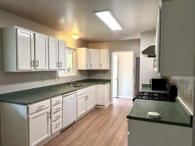 a living room with furniture or couch and a flat screen tv
