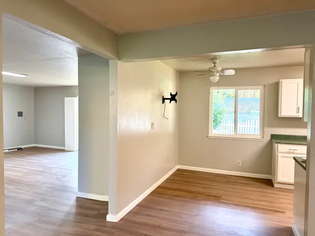 a living room with chairs and stairs