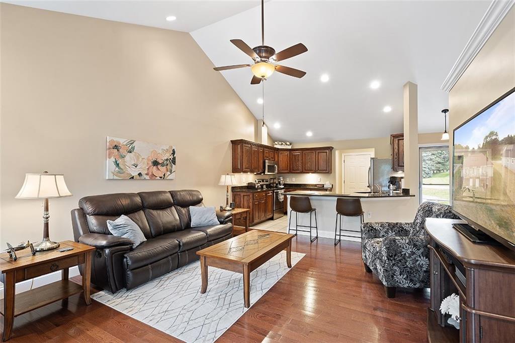 120-122 Green Brae Road Kittanning, PA 16201 - Photo 5 of 25 The Open Concept Design in the Living Room and Kitchen offer a spacious feel. Vaulted Ceilings and Recessed Lighting grow the space and light up from the Hardwood Floors.