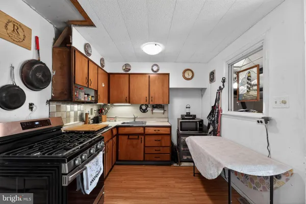 a kitchen with a stove and a refrigerator