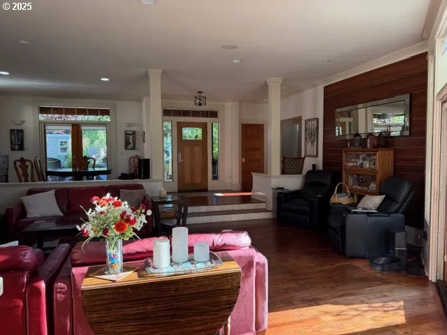 a living room with furniture and flat screen tv