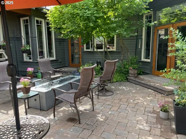 a view of a patio with couple of chairs