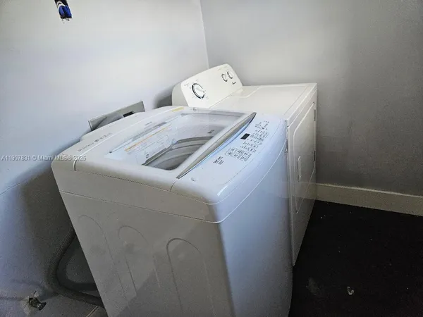 a utility room with dryer and washer