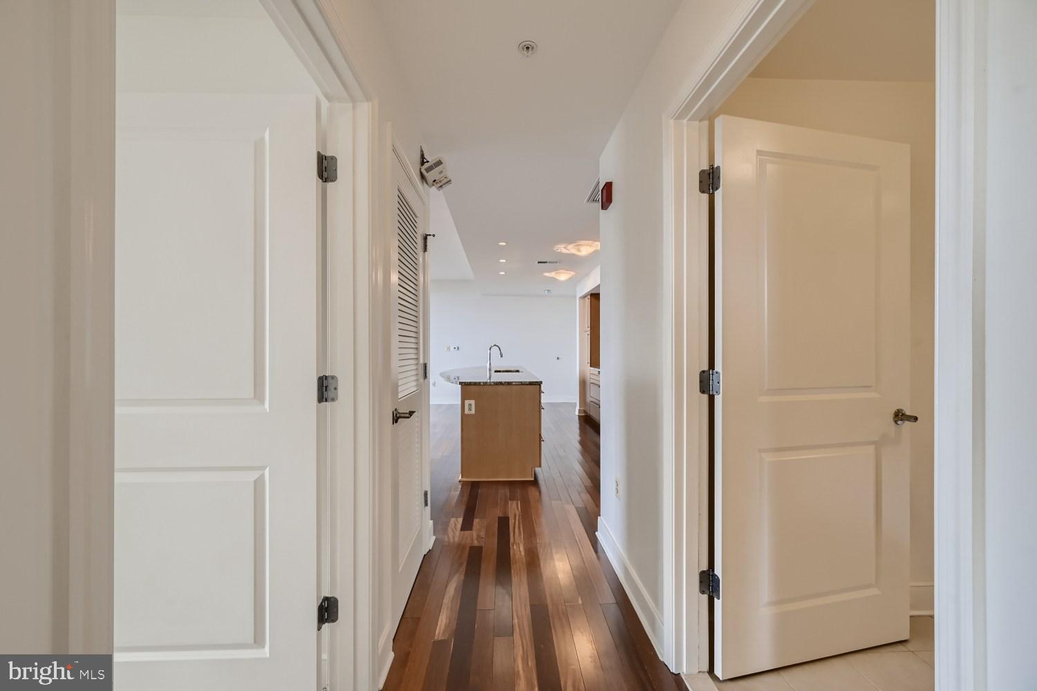 675 President Street, Unit 1709 Baltimore, MD 21202 - Photo 31 of 33 a view of a hallway with a wooden floor