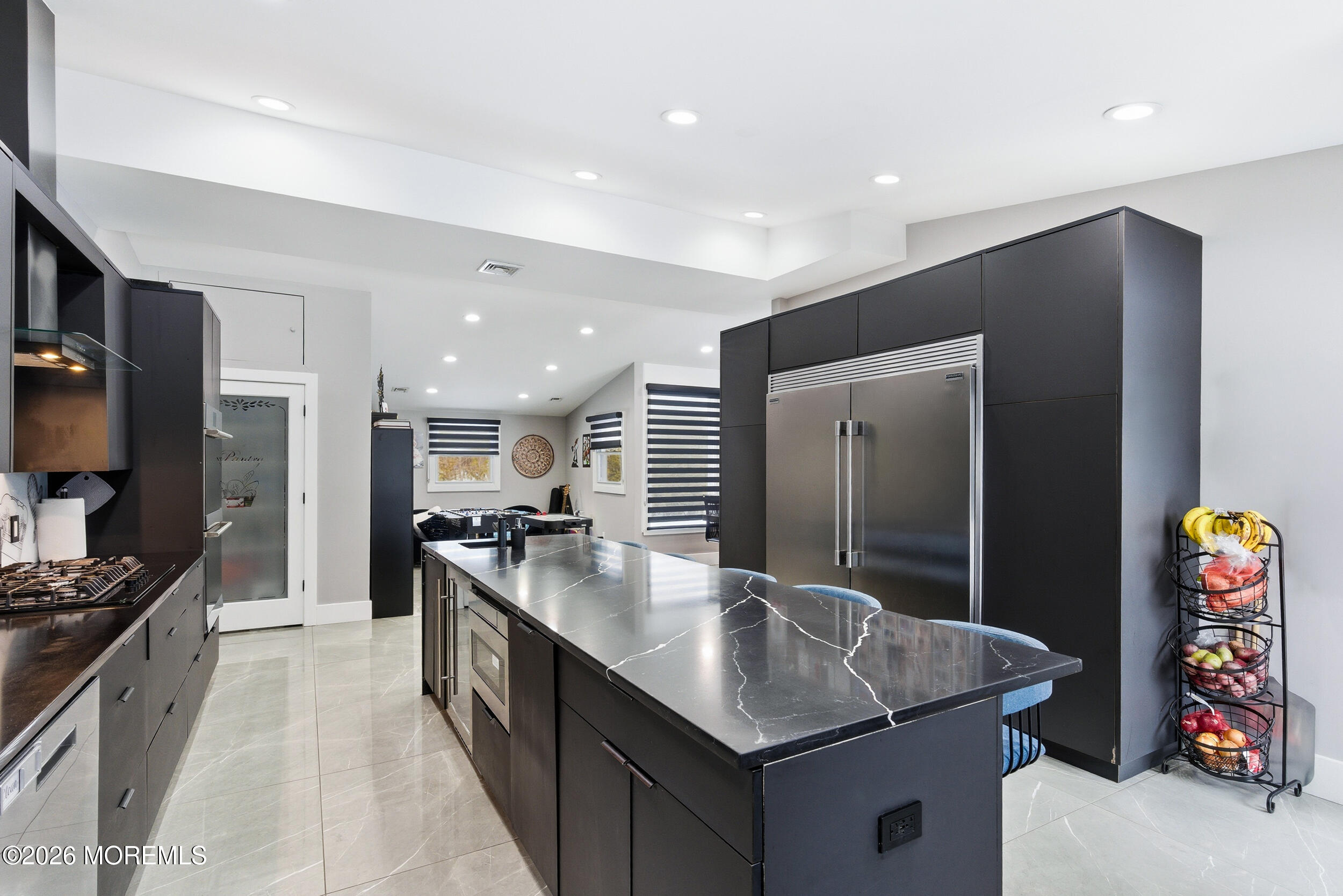 612 Deal Road Asbury Park, NJ 07712 - Photo 11 of 48 a kitchen with stainless steel appliances granite countertop a sink and a refrigerator