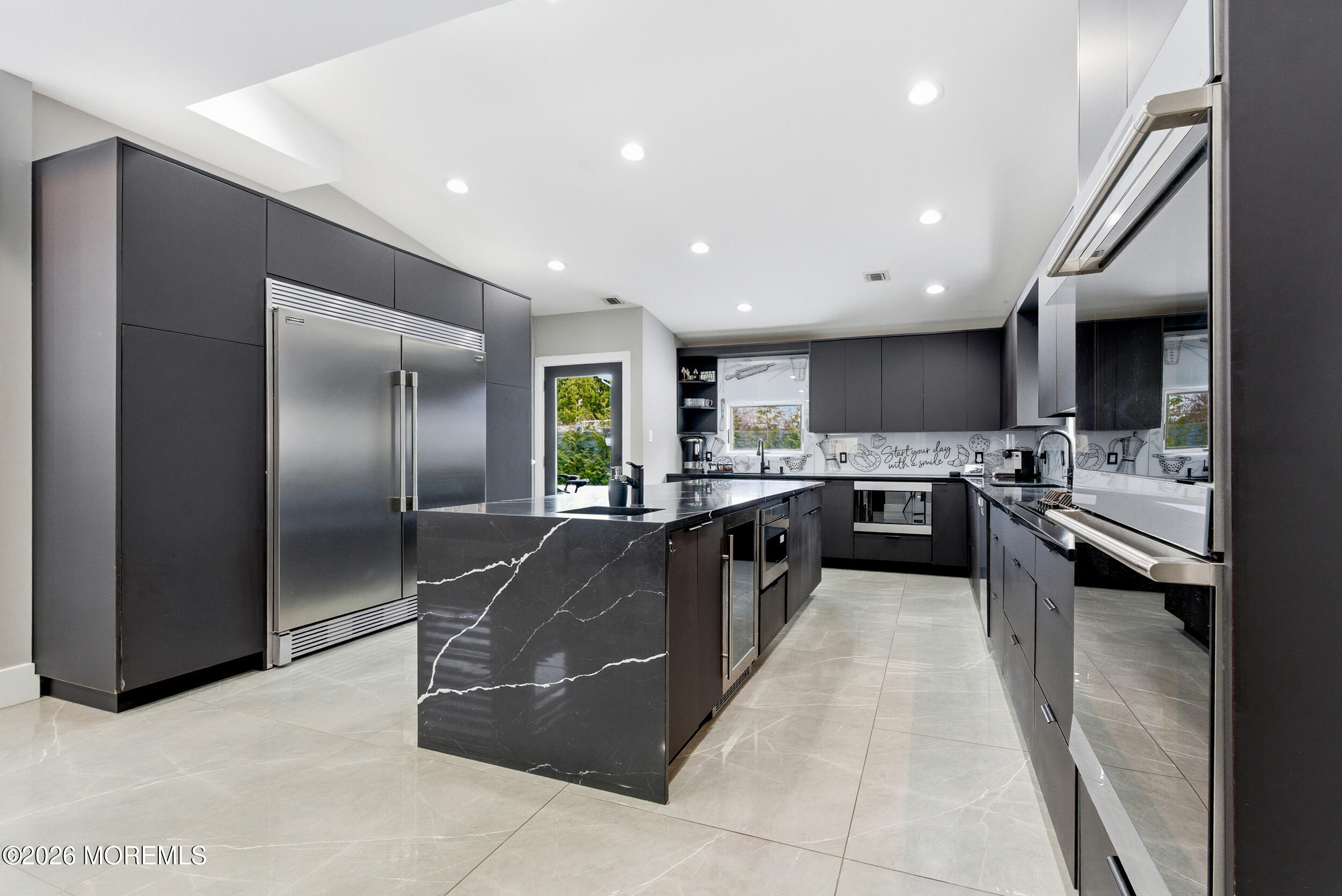 612 Deal Road Asbury Park, NJ 07712 - Photo 2 of 48 a large kitchen with a center island and stainless steel appliances