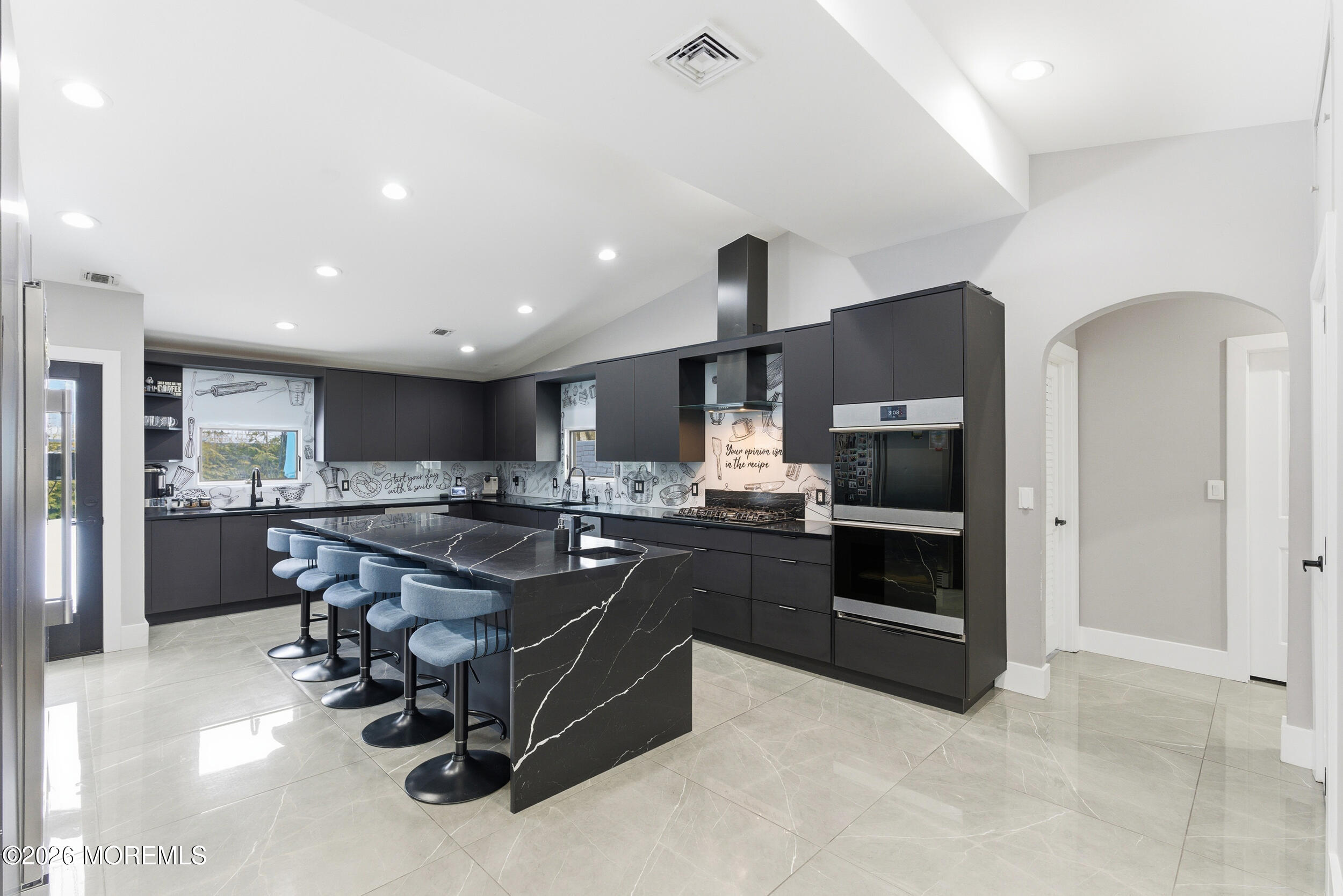 612 Deal Road Asbury Park, NJ 07712 - Photo 3 of 48 a kitchen with stainless steel appliances kitchen island granite countertop a sink and a stove