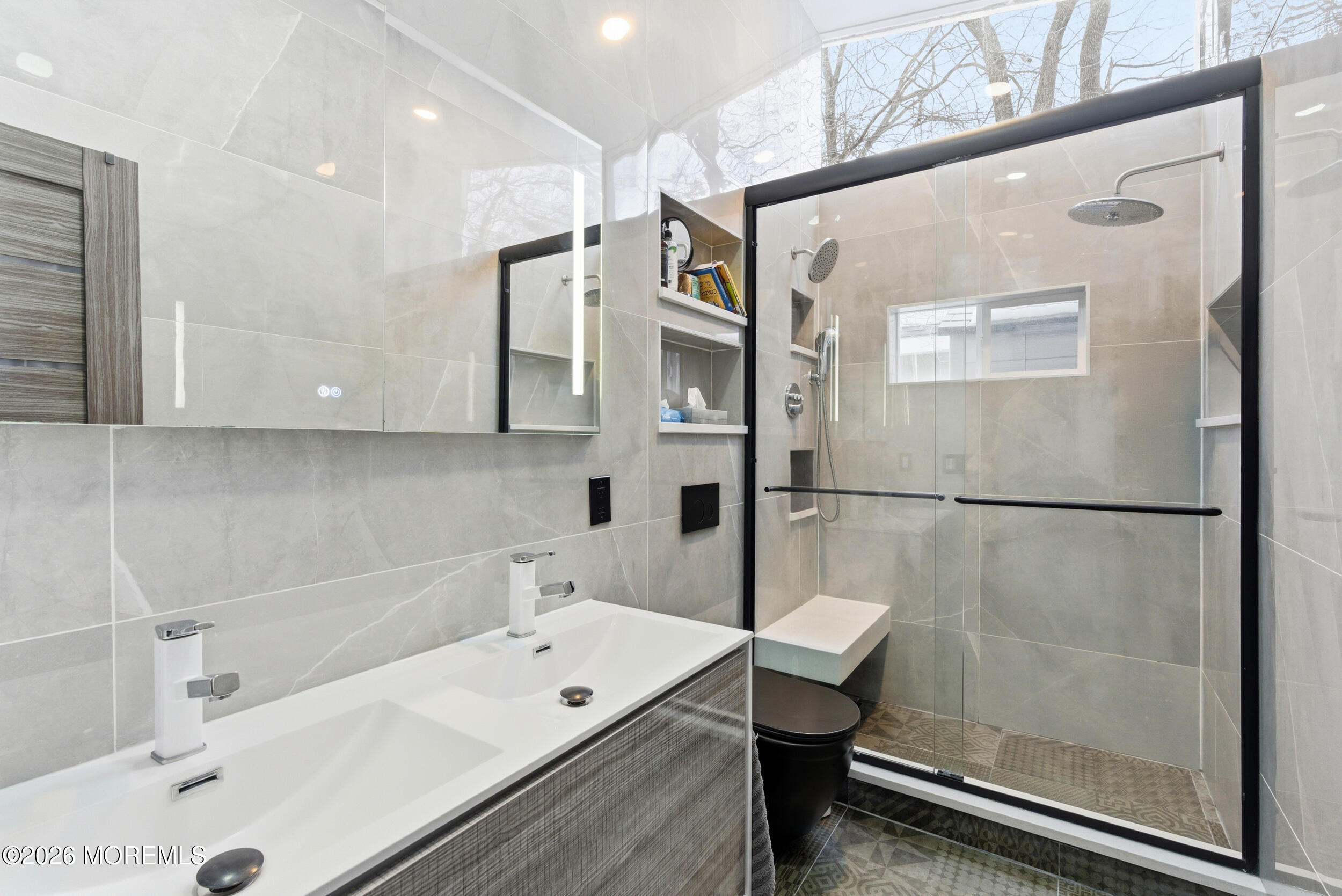 612 Deal Road Asbury Park, NJ 07712 - Photo 40 of 48 a bathroom with a tub a sink and glass door