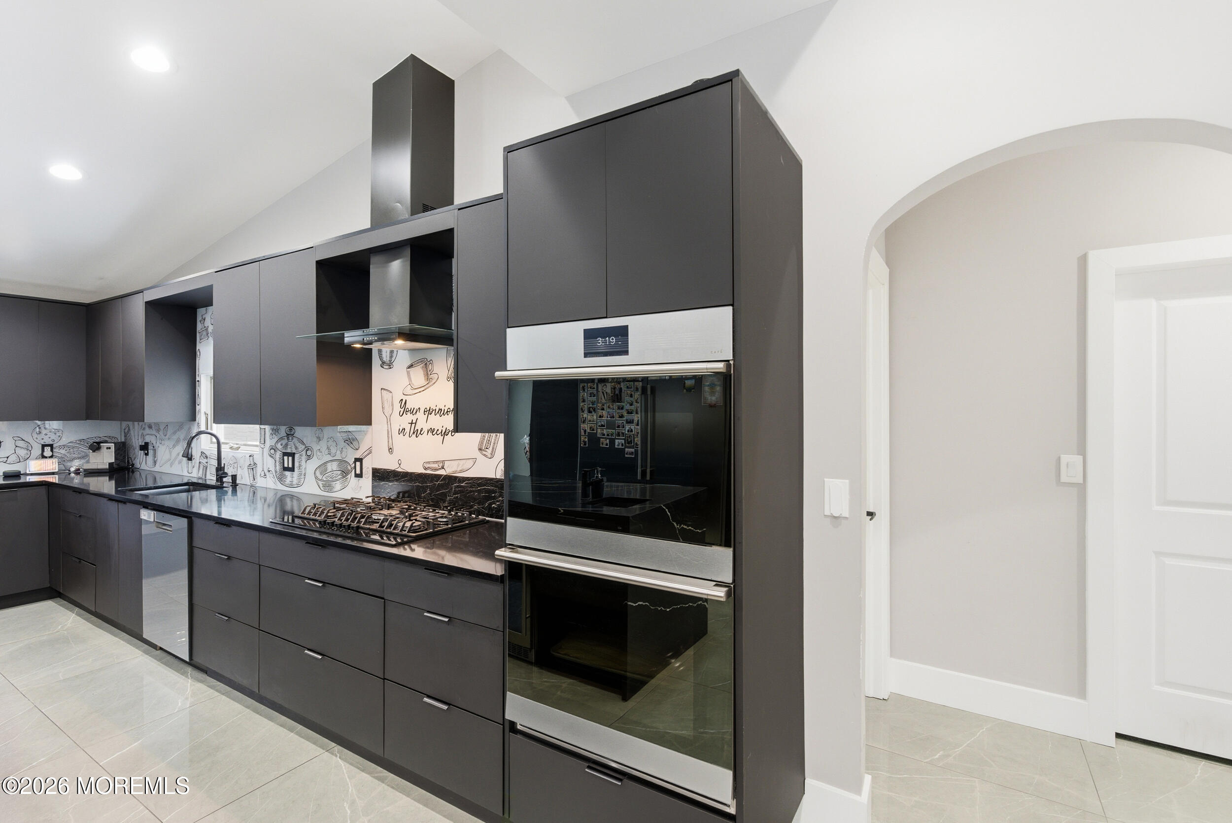 612 Deal Road Asbury Park, NJ 07712 - Photo 4 of 48 a kitchen with stainless steel appliances granite countertop a stove and a microwave