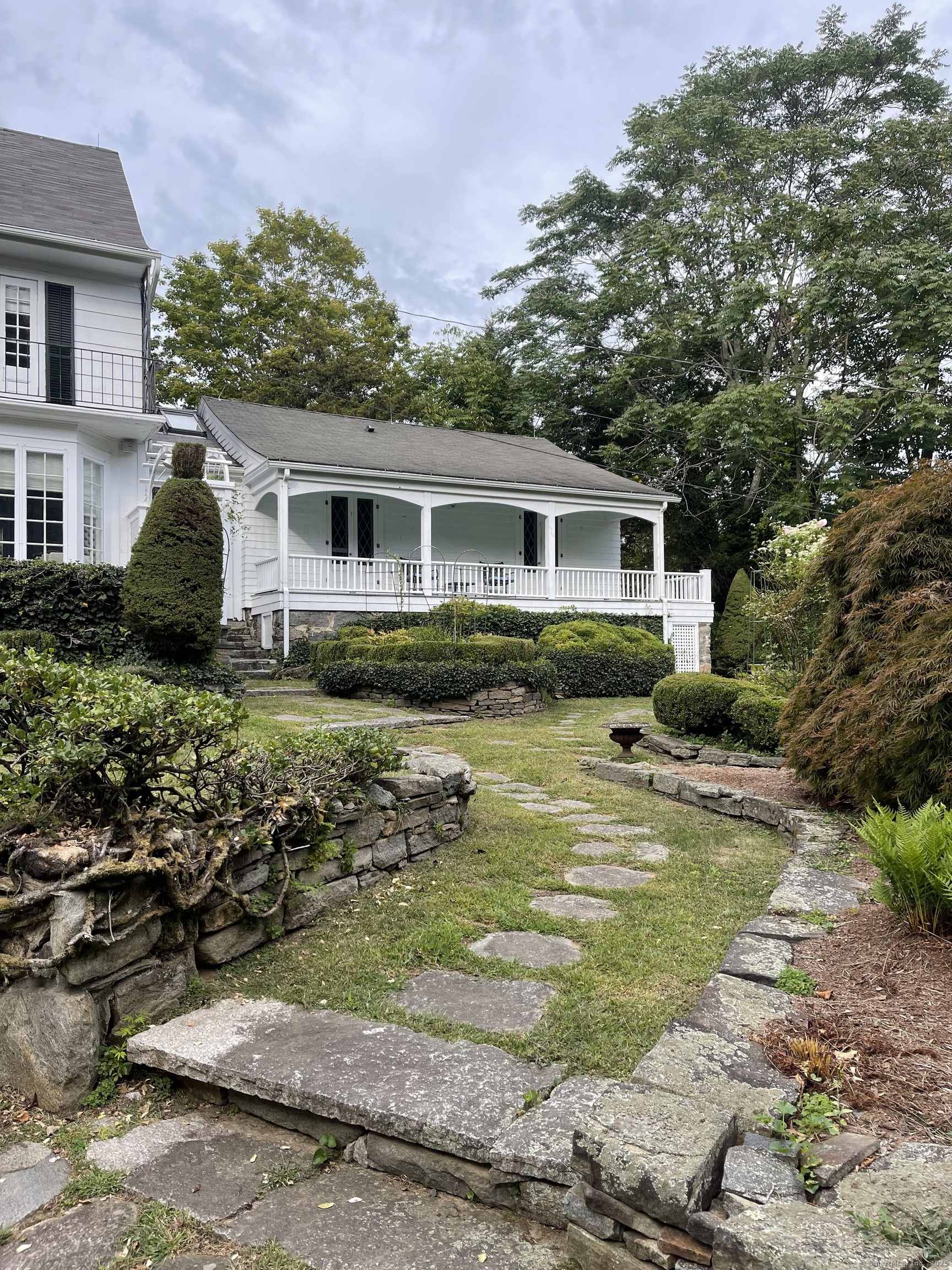 856 Boston Post Road, Unit 1 Madison, CT 06443 - Photo 2 of 25 a view of a house with swimming pool and a yard