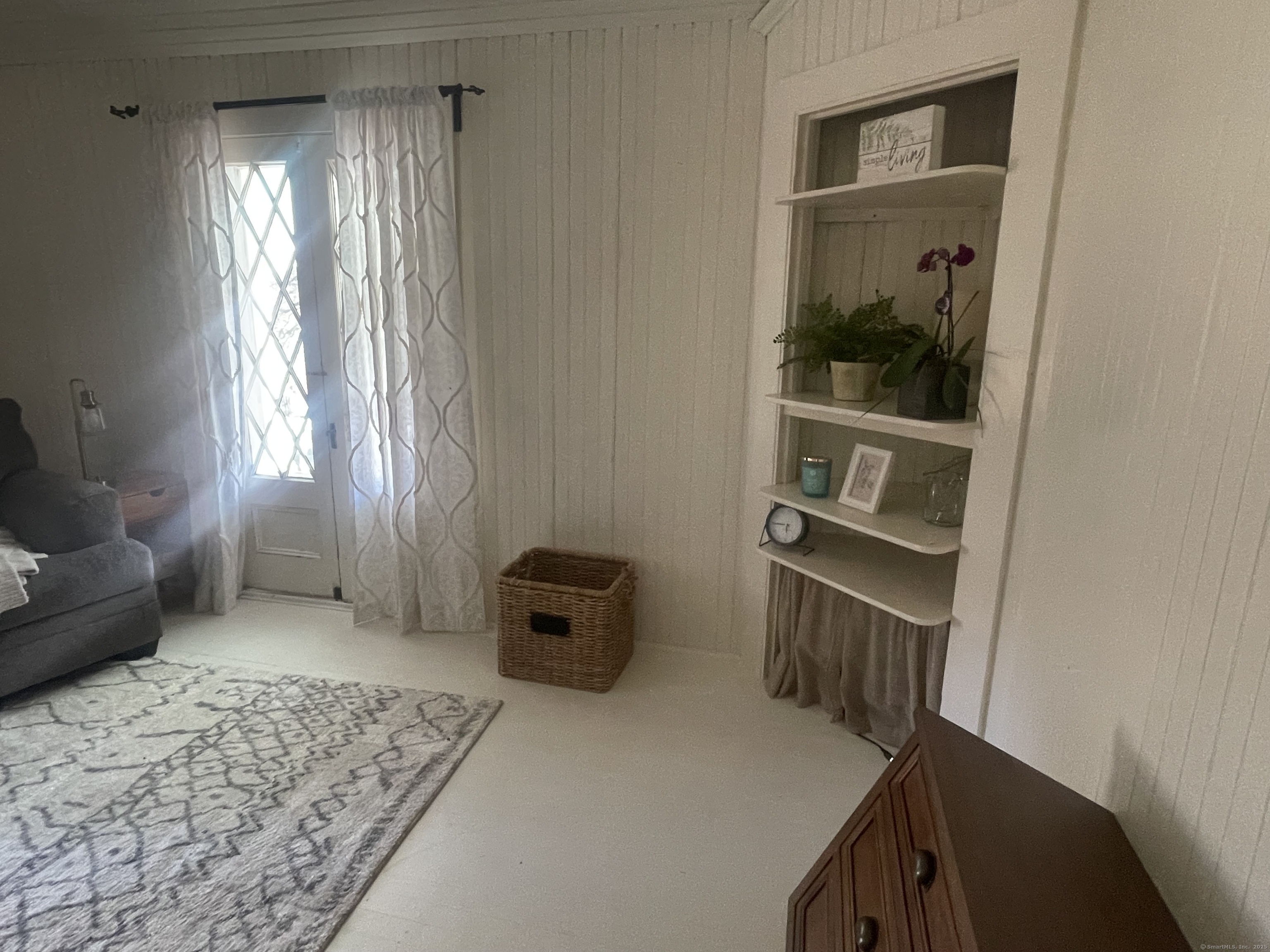 856 Boston Post Road, Unit 1 Madison, CT 06443 - Photo 21 of 25 a living room with furniture and a window