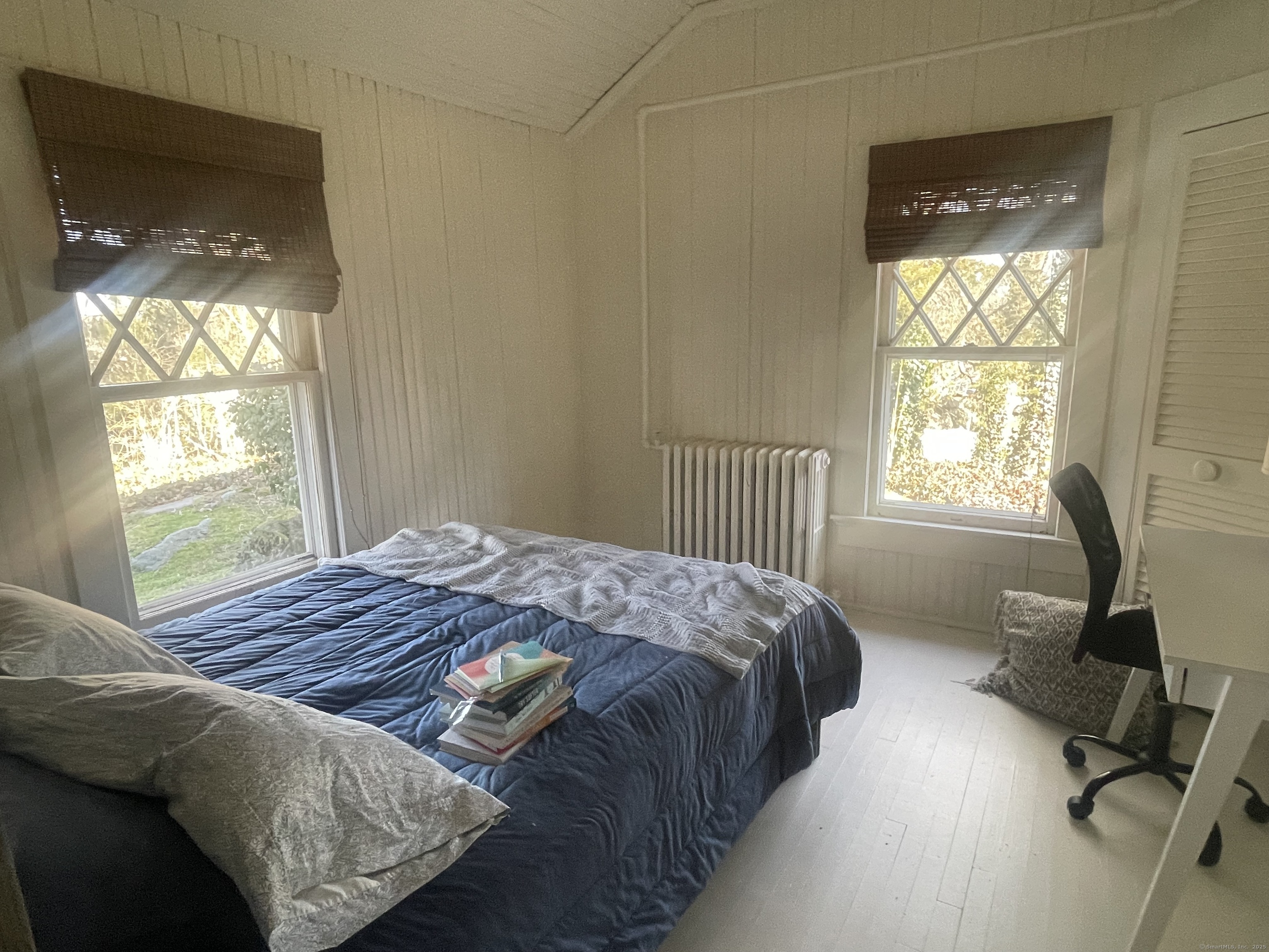 856 Boston Post Road, Unit 1 Madison, CT 06443 - Photo 23 of 25 a bedroom with a bed and a window