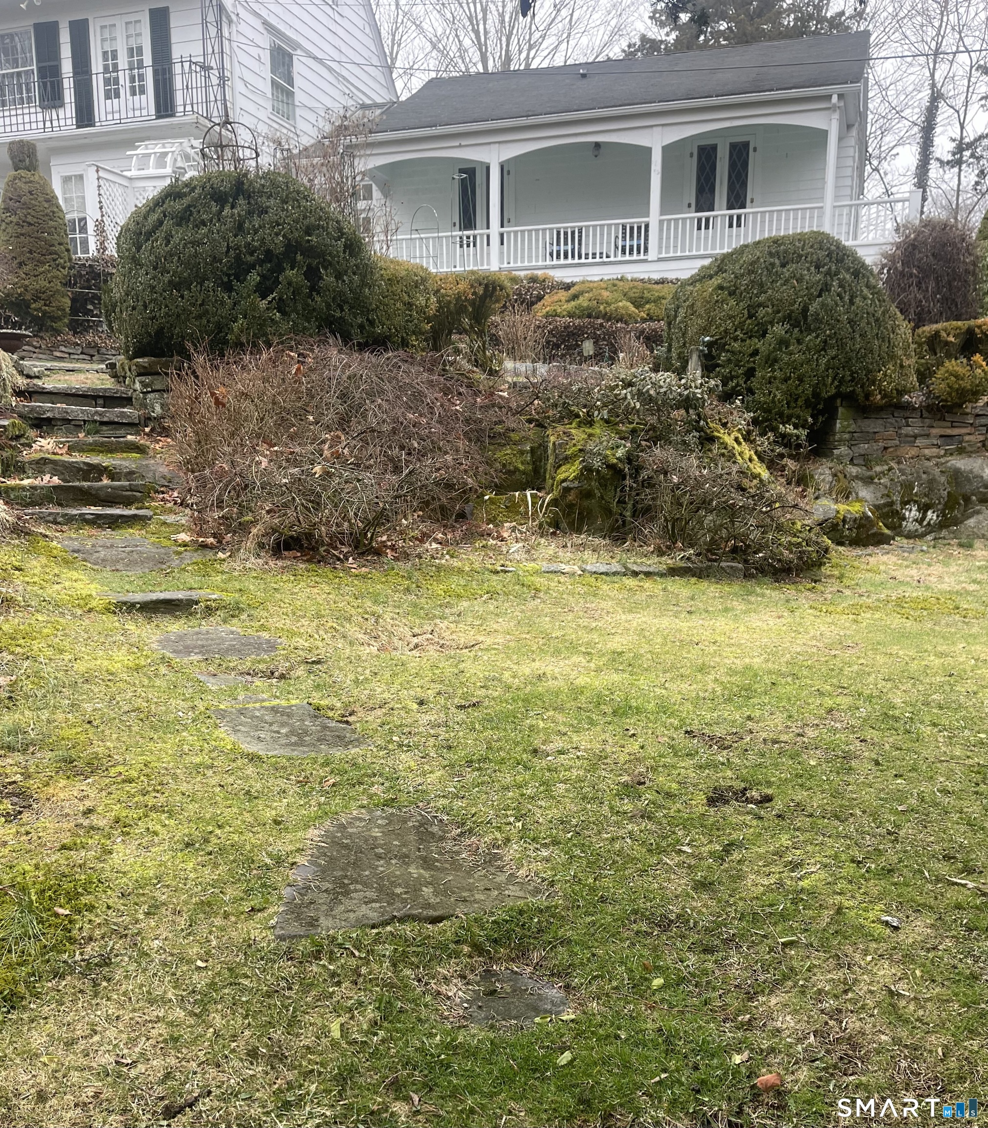 856 Boston Post Road, Unit 1 Madison, CT 06443 - Photo 26 of 27 a view of a house with a yard